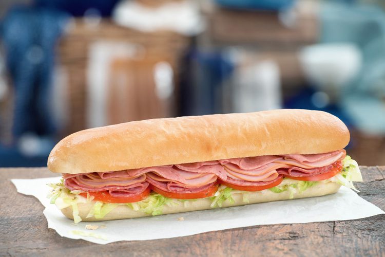 Mr.Sub Assorted sub sandwich with salami black forest ham cheese shredded lettuce tomatoes on white bread